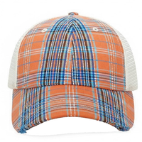 Plaid patterned cap with orange, blue, and white colors on a white background